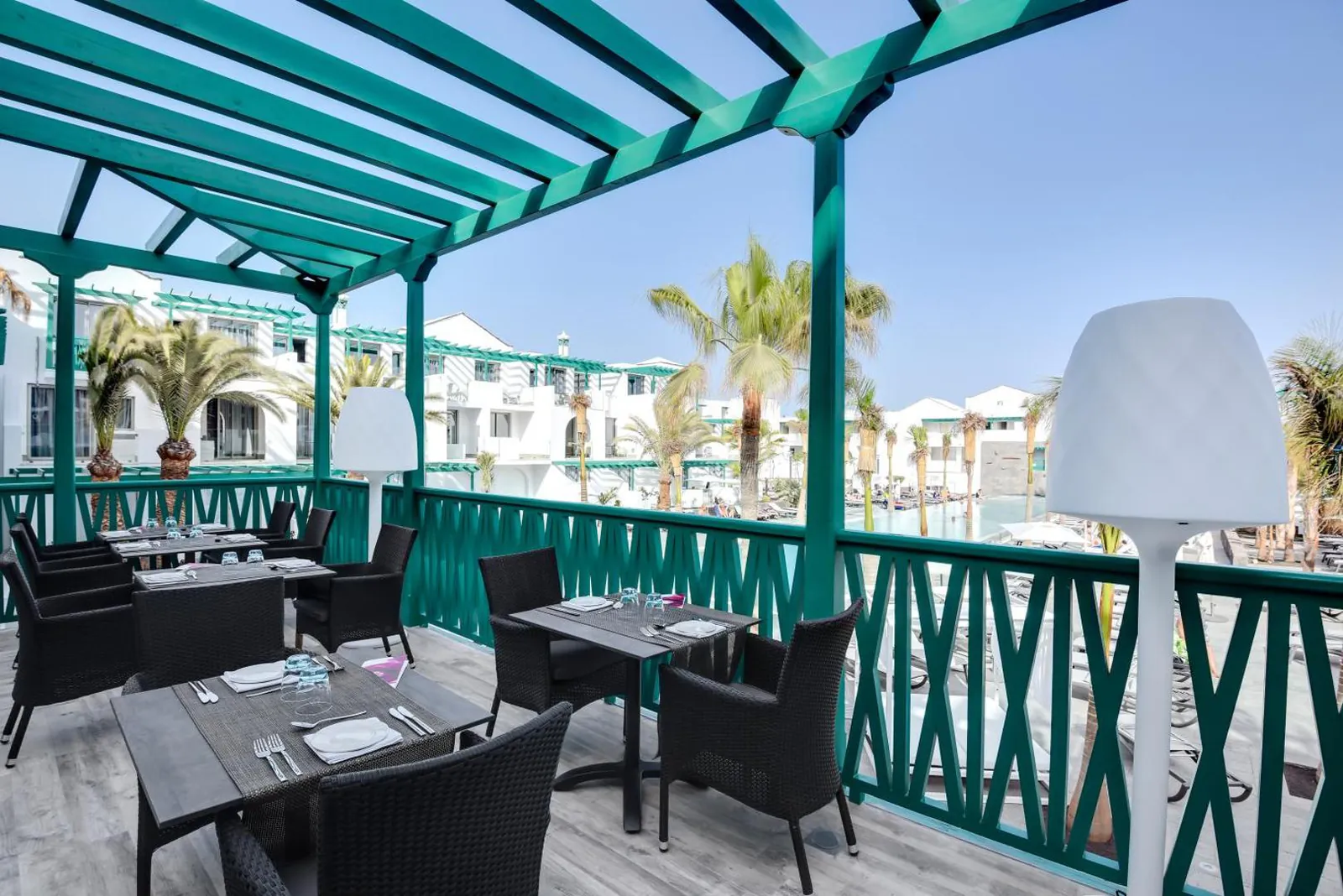 Covered terrace restaurant overlooking the pool at Barceló Teguise Beach