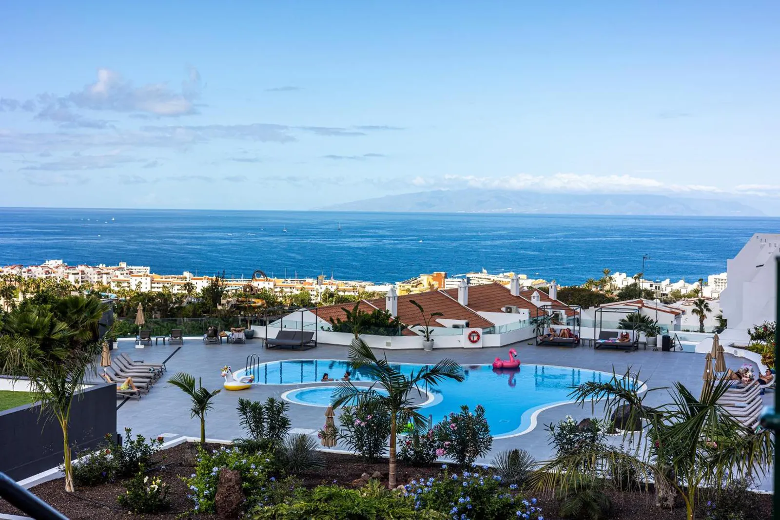 Curved pool on the hillside terrace with the Atlantic and La Gomera on the horizon