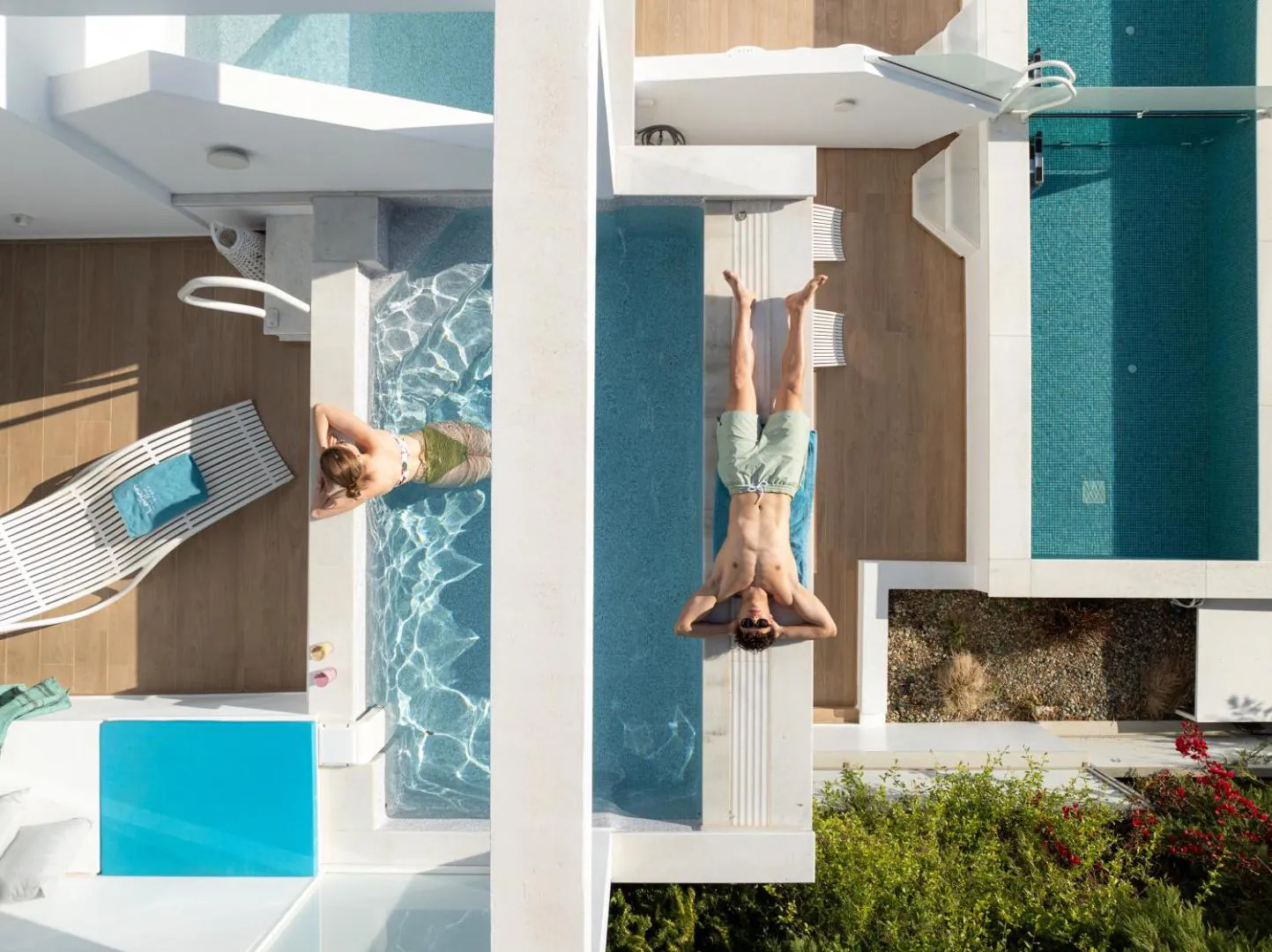 Aerial view of private pools set into the terraces of each room