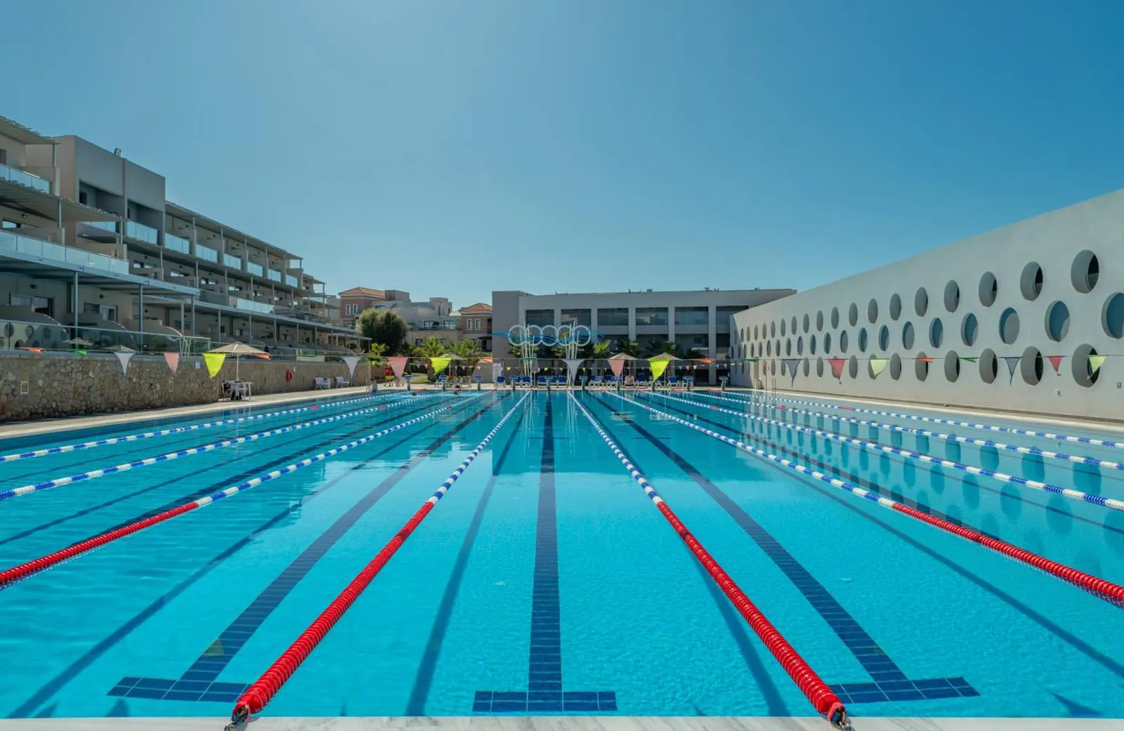 Outdoor lane pool with racing lines in front of the hotel