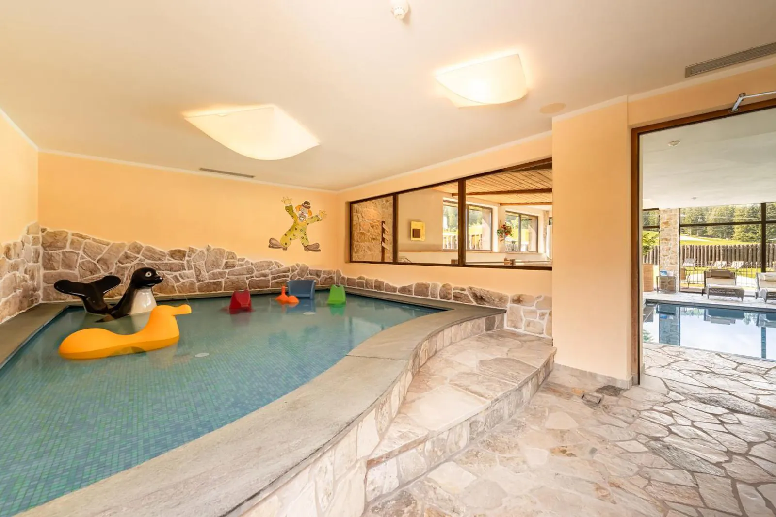 Indoor kids' pool with toys at Monte Pana Dolomites Hotel