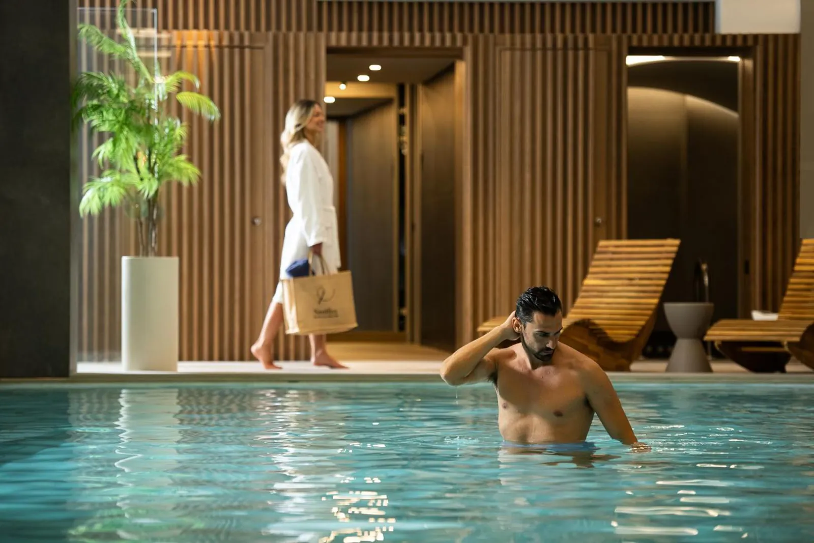 Guests in the indoor pool of the Coral Wellness spa