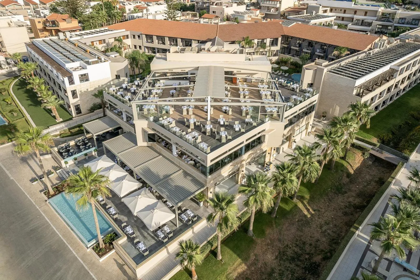 The resort from above, with pools and palm gardens between the buildings