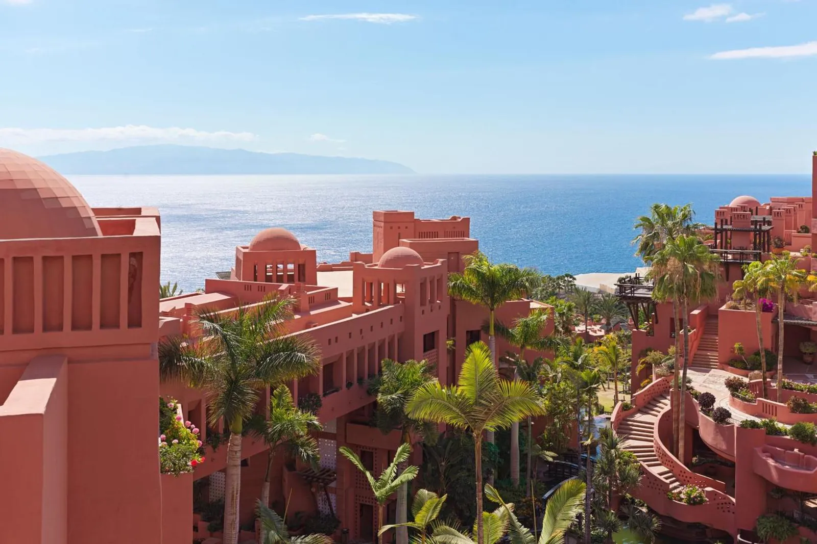 Terracotta domes and towers of Abama above the Atlantic, with La Gomera on the horizon