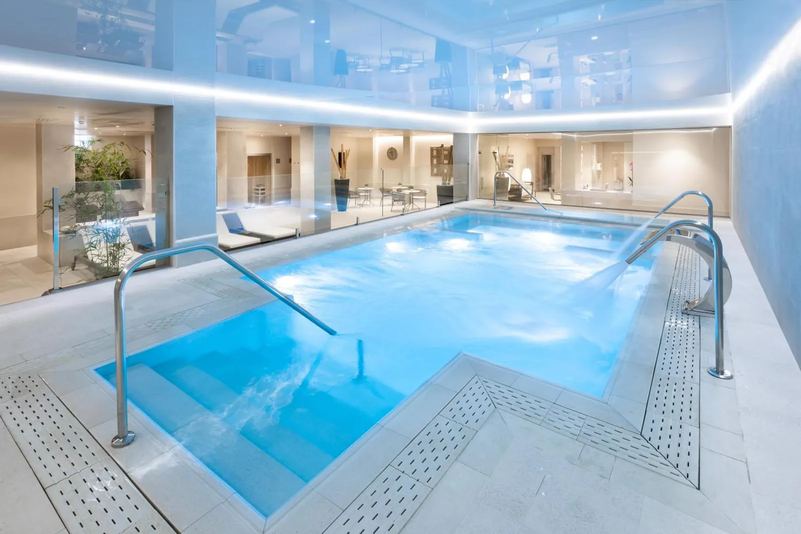 Indoor spa pool under a glossy white ceiling