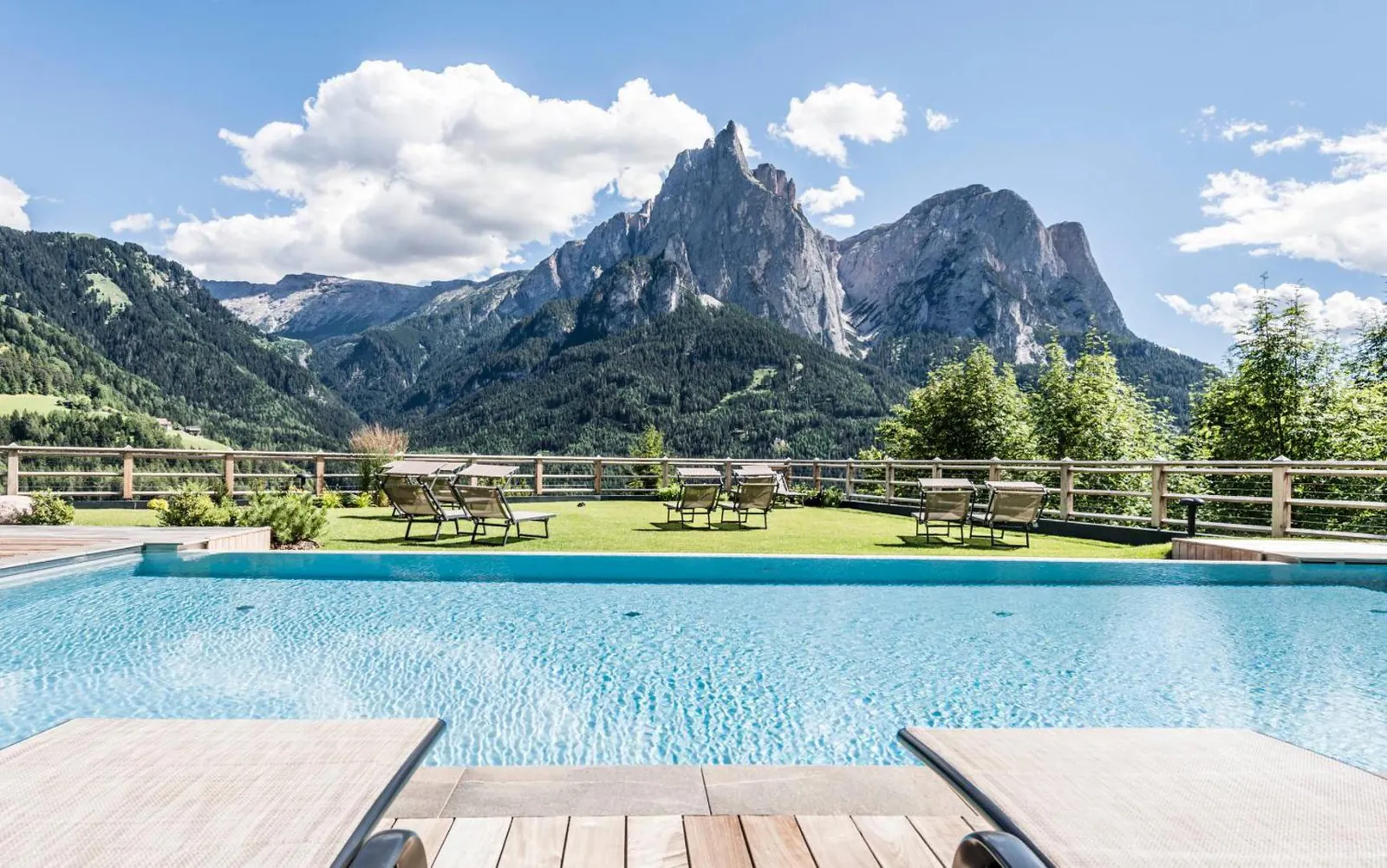 Edge of the heated outdoor pool at Sonus Alpis looking across to the Sciliar massif